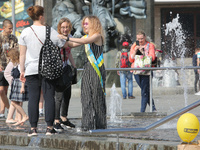 Ukrainian youth celebrates their graduation off the middle school 
with fooling in the fountains at Independence Square in Kyiv,  Ukraine,...