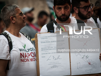 Employees of Whirlpool headquarters in Naples demonstrate against the closure of the plant at the Ministry of Economic Development on June 4...