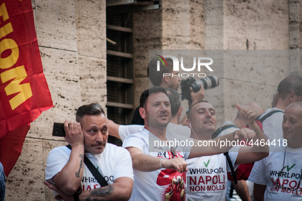 Employees of Whirlpool headquarters in Naples demonstrate against the closure of the plant at the Ministry of Economic Development on June 4...