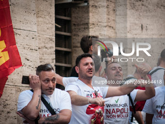 Employees of Whirlpool headquarters in Naples demonstrate against the closure of the plant at the Ministry of Economic Development on June 4...