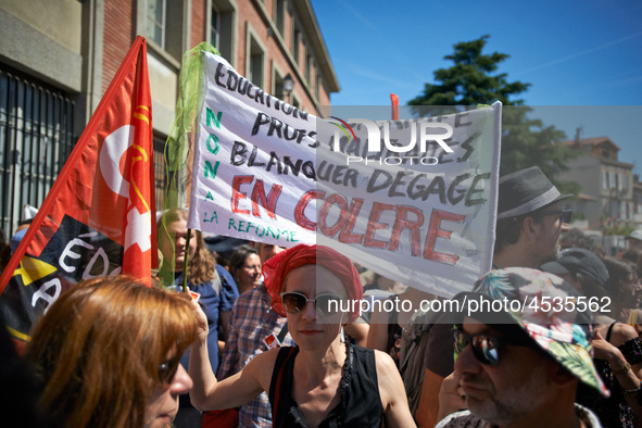 A teacher holds a banner reading 'Sacrified education, mistreated teachers, Blanquer get out !'. Some high school teachers were on strike ag...