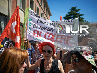 A teacher holds a banner reading 'Sacrified education, mistreated teachers, Blanquer get out !'. Some high school teachers were on strike ag...