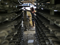 Female workers work on making tiles in clay tile factories at Pakuncen sub-district, Banyumas regency, Central Java province, on June 16, 20...