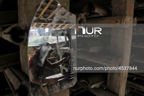 Female workers work on making tiles in clay tile factories at Pakuncen sub-district, Banyumas regency, Central Java province, on June 16, 20...