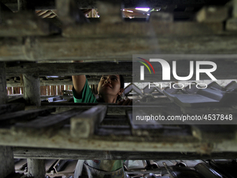 Female workers work on making tiles in clay tile factories at Pakuncen sub-district, Banyumas regency, Central Java province, on June 16, 20...