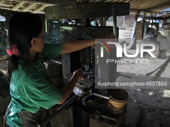 Female workers work on making tiles in clay tile factories at Pakuncen sub-district, Banyumas regency, Central Java province, on June 16, 20...