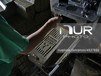 Female workers work on making tiles in clay tile factories at Pakuncen sub-district, Banyumas regency, Central Java province, on June 16, 20...