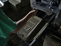 Female workers work on making tiles in clay tile factories at Pakuncen sub-district, Banyumas regency, Central Java province, on June 16, 20...