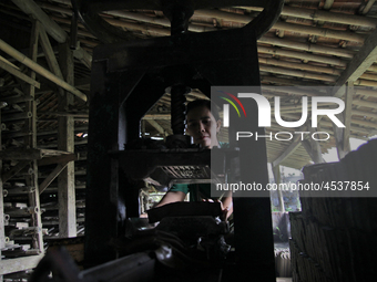 Female workers work on making tiles in clay tile factories at Pakuncen sub-district, Banyumas regency, Central Java province, on June 16, 20...