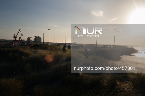 A group of migrants head towards the truck parking lot in the late afernoon. Calais, France, June 2014.

For the last 20 years the French...