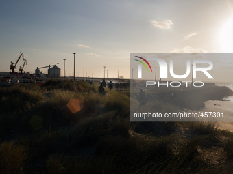 A group of migrants head towards the truck parking lot in the late afernoon. Calais, France, June 2014.

For the last 20 years the French...