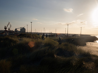 A group of migrants head towards the truck parking lot in the late afernoon. Calais, France, June 2014.

For the last 20 years the French...