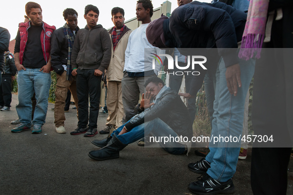 A migrants is assisted by his colleagues after reporting a police attack near the port. Calais, France, June 2014.

For the last 20 years...