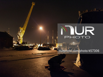 A migrant is seen praying after the sun has set. Calais, France, June 2014.

For the last 20 years the French city of Calais, with links f...