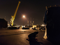 A migrant is seen praying after the sun has set. Calais, France, June 2014.

For the last 20 years the French city of Calais, with links f...