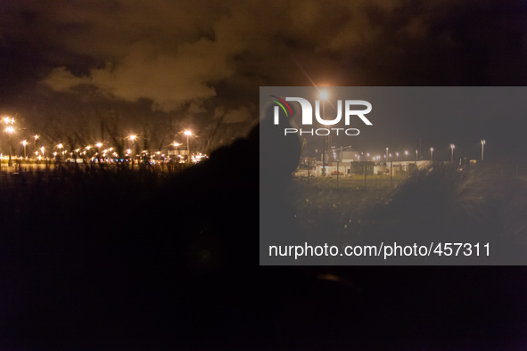 A view of the port's truck parking lot the migrants try to access at night when they are less visible. Calais, France, June 2014.

For the...