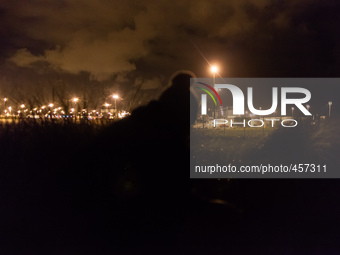 A view of the port's truck parking lot the migrants try to access at night when they are less visible. Calais, France, June 2014.

For the...