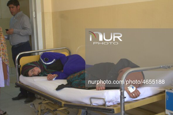 Afghan schoolgirls receive medical treatment at a local hospital after being admitted for symptoms of poisoning, in Badakhshan, Afghanistan,...