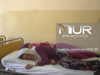 Afghan schoolgirls receive medical treatment at a local hospital after being admitted for symptoms of poisoning, in Badakhshan, Afghanistan,...