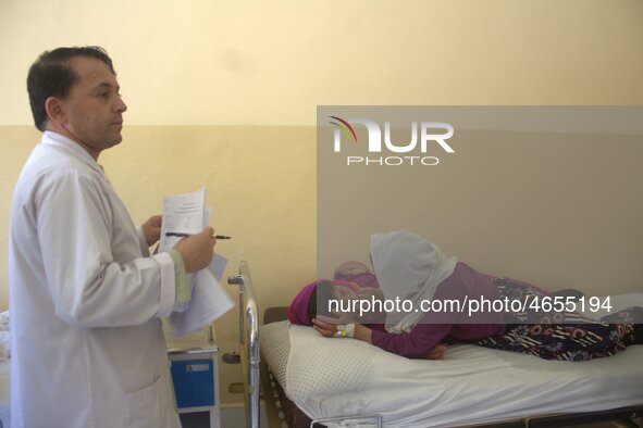 Afghan schoolgirls receive medical treatment at a local hospital after being admitted for symptoms of poisoning, in Badakhshan, Afghanistan,...