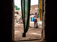 Children play in the small courtyard outside of their home
"The land of honest man". With these words Shankara has defined his people befor...