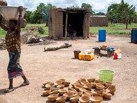 A woman during the preparation of the malice, the local beer made with the mile
"The land of honest man". With these words Shankara has def...