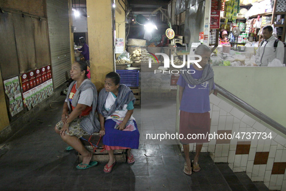 Female freight workers waiting for customers in Beringharjo traditional market, Special Region of Yogyakarta province, on Monday, August 5,...