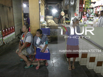 Female freight workers waiting for customers in Beringharjo traditional market, Special Region of Yogyakarta province, on Monday, August 5,...