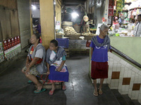 Female freight workers waiting for customers in Beringharjo traditional market, Special Region of Yogyakarta province, on Monday, August 5,...