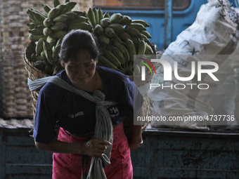 Female freight workers serve customers in Beringharjo traditional market, Special Region of Yogyakarta province, on Monday, August 5, 2019....