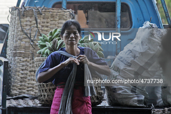 Female freight workers serve customers in Beringharjo traditional market, Special Region of Yogyakarta province, on Monday, August 5, 2019....