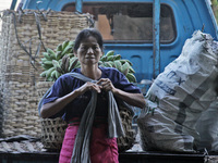 Female freight workers serve customers in Beringharjo traditional market, Special Region of Yogyakarta province, on Monday, August 5, 2019....