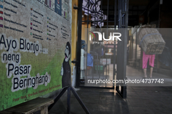 Female freight workers serve customers in Beringharjo traditional market, Special Region of Yogyakarta province, on Monday, August 5, 2019....