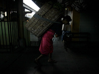 Female freight workers serve customers in Beringharjo traditional market, Special Region of Yogyakarta province, on Monday, August 5, 2019....