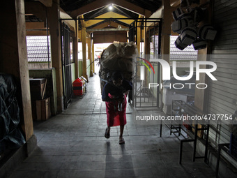 Female freight workers serve customers in Beringharjo traditional market, Special Region of Yogyakarta province, on Monday, August 5, 2019....