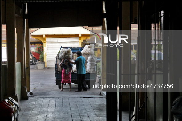 Female freight workers serve customers in Beringharjo traditional market, Special Region of Yogyakarta province, on Monday, August 5, 2019....