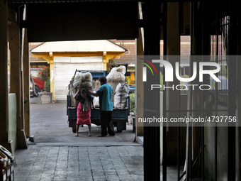 Female freight workers serve customers in Beringharjo traditional market, Special Region of Yogyakarta province, on Monday, August 5, 2019....