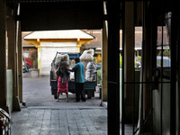 Female freight workers serve customers in Beringharjo traditional market, Special Region of Yogyakarta province, on Monday, August 5, 2019....