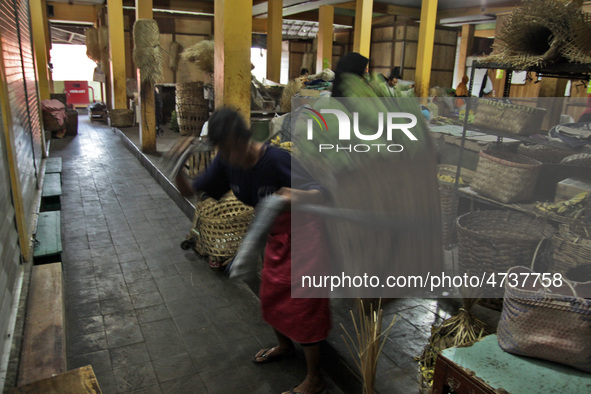 Female freight workers serve customers in Beringharjo traditional market, Special Region of Yogyakarta province, on Monday, August 5, 2019....