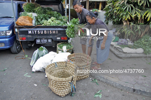 Female freight workers serve customers in Beringharjo traditional market, Special Region of Yogyakarta province, on Monday, August 5, 2019....