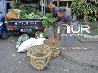 Female freight workers serve customers in Beringharjo traditional market, Special Region of Yogyakarta province, on Monday, August 5, 2019....