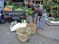 Female freight workers serve customers in Beringharjo traditional market, Special Region of Yogyakarta province, on Monday, August 5, 2019....