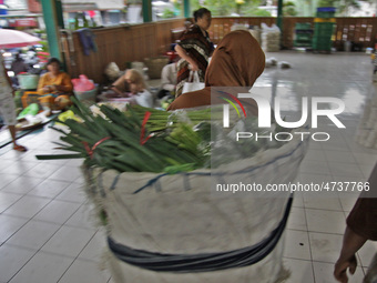 Female freight workers serve customers in Beringharjo traditional market, Special Region of Yogyakarta province, on Monday, August 5, 2019....