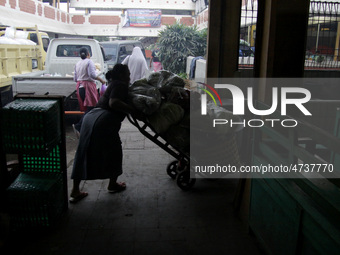 Female freight workers serve customers in Beringharjo traditional market, Special Region of Yogyakarta province, on Monday, August 5, 2019....