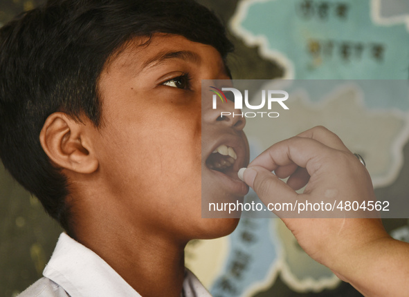 School student recieves Albendazole tablet as part of India's National Deworming Programme at a primary school in Guwahati, Assam, India on...