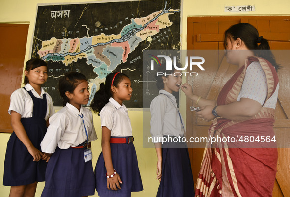 School student recieves Albendazole tablet as part of India's National Deworming Programme at a primary school in Guwahati, Assam, India on...