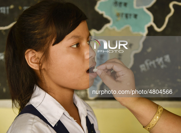 School student recieves Albendazole tablet as part of India's National Deworming Programme at a primary school in Guwahati, Assam, India on...