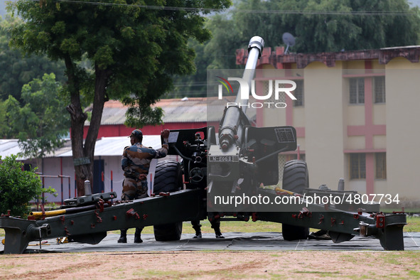 Indian school students take a close look at the various defence equipment during an exhibition organised by the Indian Army in Ajmer, Rajast...