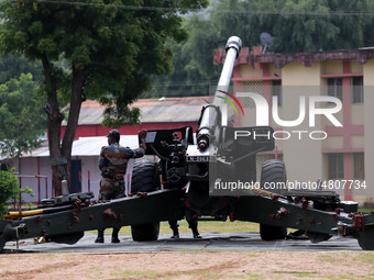 Indian school students take a close look at the various defence equipment during an exhibition organised by the Indian Army in Ajmer, Rajast...