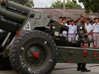 Indian school students take a close look at the various defence equipment during an exhibition organised by the Indian Army in Ajmer, Rajast...